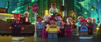 Movie still from “The Lego Batman Movie” (2017), directed by Chris McKay – A group of lego people standing next to a stop sign; Medium shot, Low angle