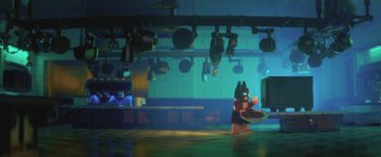 Movie still from “The Lego Batman Movie” (2017), directed by Chris McKay – A lego figure in a kitchen with a frying pan in hand; Extreme Wide shot, Over the shoulder angle