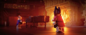 Movie still from “The Lego Batman Movie” (2017), directed by Chris McKay – A lego figure that is standing in front of a piano; Wide shot, Over the shoulder angle