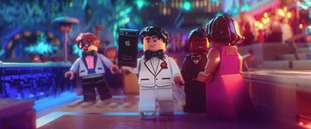 Movie still from “The Lego Batman Movie” (2017), directed by Chris McKay – A man that is holding up a cell phone; Extreme Close Up shot, Over the shoulder angle