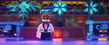 Movie still from “The Lego Batman Movie” (2017), directed by Chris McKay – A lego figure is standing in front of a neon light; Medium shot, Over the shoulder angle