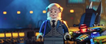 Movie still from “The Lego Batman Movie” (2017), directed by Chris McKay – A lego figure wearing a suit and tie; Close Up shot, Over the shoulder angle
