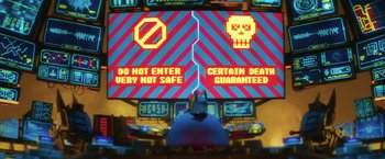 Movie still from “The Lego Batman Movie” (2017), directed by Chris McKay – A person is sitting in front of a large screen; Extreme Wide shot, Low angle