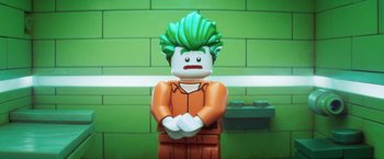 Movie still from “The Lego Batman Movie” (2017), directed by Chris McKay – A lego figure that has green hair; Close Up shot, Over the shoulder angle