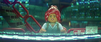 Movie still from “The Lego Batman Movie” (2017), directed by Chris McKay – A lego figure is sitting in a chair; Close Up shot, Over the shoulder angle