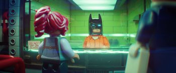 Movie still from “The Lego Batman Movie” (2017), directed by Chris McKay – A lego batman is sitting in front of a woman; Close Up shot, Over the shoulder angle