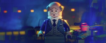 Movie still from “The Lego Batman Movie” (2017), directed by Chris McKay – A lego figure of a man in a suit and tie; Close Up shot, Over the shoulder angle