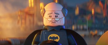 Movie still from “The Lego Batman Movie” (2017), directed by Chris McKay – A lego figure of a man in a batman costume; Close Up shot, Over the shoulder angle
