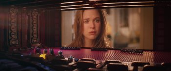 Movie still from “The Lego Batman Movie” (2017), directed by Chris McKay – A girl looking at her reflection in a mirror; Wide shot, Over the shoulder angle