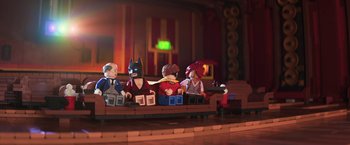 Movie still from “The Lego Batman Movie” (2017), directed by Chris McKay – A group of people sitting on top of a wooden bench; Wide shot, High angle