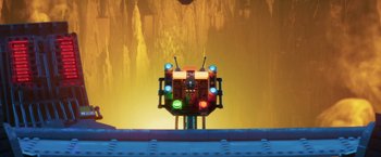 Movie still from “The Lego Batman Movie” (2017), directed by Chris McKay – A robot with a bunch of traffic lights on top of it; Extreme Wide shot, Low angle