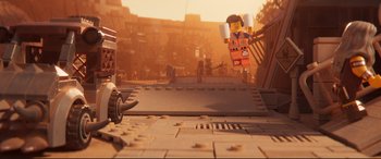 Movie still from “The Lego Movie 2: The Second Part” (2019), directed by Mike Mitchell – A scene of a lego movie scene with a person flying through the air; Extreme Wide shot, High angle