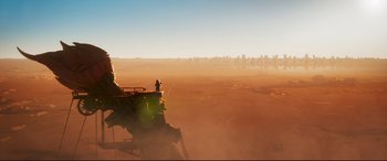 Movie still from “The Lego Movie 2: The Second Part” (2019), directed by Mike Mitchell – A man standing on top of a tractor in the middle of a field; Extreme Wide shot, High angle