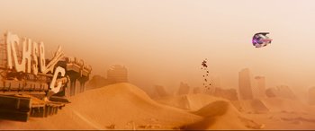 Movie still from “The Lego Movie 2: The Second Part” (2019), directed by Mike Mitchell – A kite flying in the air over a sandy beach; Extreme Wide shot, High angle