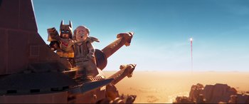 Movie still from “The Lego Movie 2: The Second Part” (2019), directed by Mike Mitchell – A toy is sitting on top of a toy tank; Wide shot, Low angle