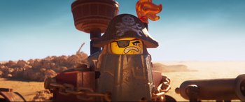 Movie still from “The Lego Movie 2: The Second Part” (2019), directed by Mike Mitchell – A lego character that has been chained up; Close Up shot, Low angle