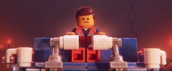 Movie still from “The Lego Movie 2: The Second Part” (2019), directed by Mike Mitchell – A lego man sitting on top of a blue chair; Close Up shot, Low angle
