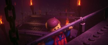 Movie still from “The Lego Movie 2: The Second Part” (2019), directed by Mike Mitchell – A lego man that is holding a pipe; Close Up shot, Overhead angle