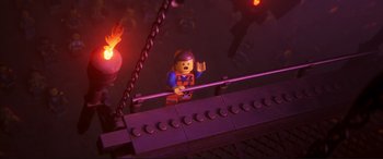 Movie still from “The Lego Movie 2: The Second Part” (2019), directed by Mike Mitchell – A lego man is standing on a bridge; Medium shot, Overhead angle