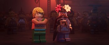 Movie still from “The Lego Movie 2: The Second Part” (2019), directed by Mike Mitchell – Two lego figures are standing next to each other; Medium shot, Over the shoulder angle