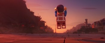 Movie still from “The Lego Movie 2: The Second Part” (2019), directed by Mike Mitchell – A lego character flying through the air at sunset; Wide shot, Low angle