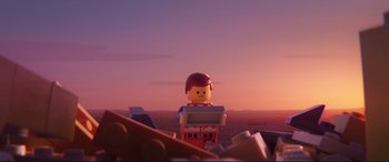 Movie still from “The Lego Movie 2: The Second Part” (2019), directed by Mike Mitchell – A lego figure is sitting on top of a pile of legos; Close Up shot, Over the shoulder angle