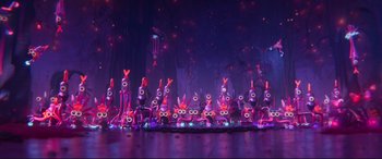 Movie still from “The Lego Movie 2: The Second Part” (2019), directed by Mike Mitchell – A group of purple characters sitting on top of each other; Extreme Wide shot, High angle