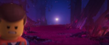 Movie still from “The Lego Movie 2: The Second Part” (2019), directed by Mike Mitchell – An image of a purple scene with trees in the background; Extreme Wide shot, High angle
