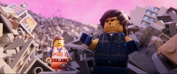 Movie still from “The Lego Movie 2: The Second Part” (2019), directed by Mike Mitchell – Two lego figures are standing in a pile of rubble; Close Up shot, Over the shoulder angle