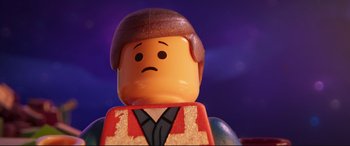 Movie still from “The Lego Movie 2: The Second Part” (2019), directed by Mike Mitchell – A lego man that has a sad look on his face; Close Up shot, Low angle