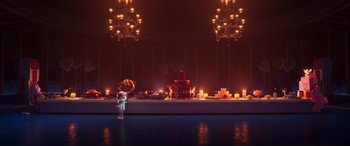 Movie still from “The Lego Movie 2: The Second Part” (2019), directed by Mike Mitchell – A woman standing in front of a table with candles; Extreme Wide shot, Over the shoulder angle