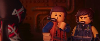 Movie still from “The Lego Movie 2: The Second Part” (2019), directed by Mike Mitchell – A lego man that is talking on the phone; Close Up shot, Over the shoulder angle