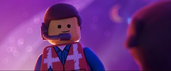 Movie still from “The Lego Movie 2: The Second Part” (2019), directed by Mike Mitchell – A lego character with a purple background; Close Up shot, Over the shoulder angle