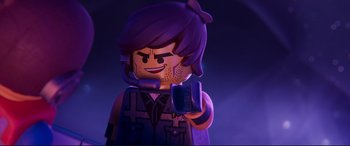 Movie still from “The Lego Movie 2: The Second Part” (2019), directed by Mike Mitchell – A lego character holding a cell phone; Close Up shot, Over the shoulder angle