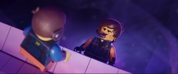 Movie still from “The Lego Movie 2: The Second Part” (2019), directed by Mike Mitchell – A lego figure is sitting in front of another lego figure; Close Up shot, Over the shoulder angle