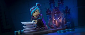 Movie still from “The Lego Movie 2: The Second Part” (2019), directed by Mike Mitchell – A lego figure is standing next to a stack of paper; Medium shot, Over the shoulder angle
