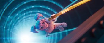 Movie still from “The Lego Movie 2: The Second Part” (2019), directed by Mike Mitchell – A lego figure of a girl holding a light saber; Wide shot, Low angle