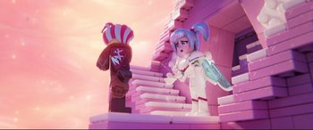 Movie still from “The Lego Movie 2: The Second Part” (2019), directed by Mike Mitchell – A lego figure is standing next to a lego character; Wide shot, Over the shoulder angle