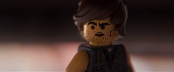 Movie still from “The Lego Movie 2: The Second Part” (2019), directed by Mike Mitchell – The head and face of a lego man; Extreme Close Up shot, Over the shoulder angle