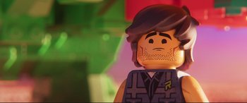 Movie still from “The Lego Movie 2: The Second Part” (2019), directed by Mike Mitchell – A lego man's face; Extreme Close Up shot, Over the shoulder angle