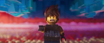 Movie still from “The Lego Movie 2: The Second Part” (2019), directed by Mike Mitchell – A lego figure with a blurry background; Close Up shot, Overhead angle