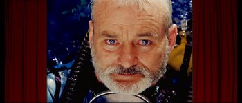 Movie still from “The Life Aquatic with Steve Zissou” (2004), directed by Wes Anderson – An older man with a beard wearing a scuba diving suit; Close Up shot, Low angle