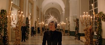 Movie still from “The Life Aquatic with Steve Zissou” (2004), directed by Wes Anderson – A woman in a black jacket and a white hat in a room; Medium shot, Low angle