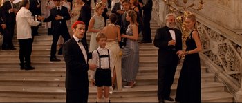 Movie still from “The Life Aquatic with Steve Zissou” (2004), directed by Wes Anderson – A group of people standing on a set of stairs; Medium shot, Over the shoulder angle