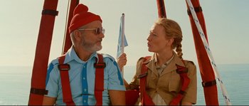 Movie still from “The Life Aquatic with Steve Zissou” (2004), directed by Wes Anderson – A man and a woman are sitting in a hot air balloon; Medium shot, Low angle