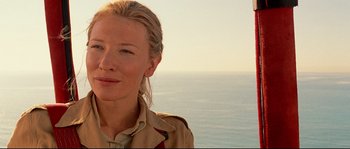 Movie still from “The Life Aquatic with Steve Zissou” (2004), directed by Wes Anderson – A person wearing a jacket near a body of water; Close Up shot, Over the shoulder angle