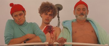 Movie still from “The Life Aquatic with Steve Zissou” (2004), directed by Wes Anderson – A man with blood all over his face and chest; Medium shot, Over the shoulder angle