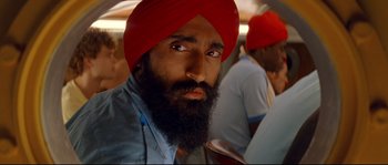 Movie still from “The Life Aquatic with Steve Zissou” (2004), directed by Wes Anderson – A man with a red turban and a beard; Close Up shot, Low angle