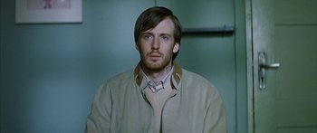 Movie still from “The Lives of Others” (2006), directed by Florian Henckel von Donnersmarck – A person wearing a jacket; Close Up shot, Over the shoulder angle