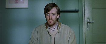 Movie still from “The Lives of Others” (2006), directed by Florian Henckel von Donnersmarck – A person wearing a jacket; Close Up shot, Over the shoulder angle